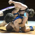 Sequims Sam Fitzgerald, top, grapples with Bainbridge wrestler Quenton Ikuse in an Olympic League double dual in Sequim on June 5. Sequim Gazette photos by Michael Dashiell