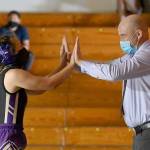 Sequims Jordan Hegtvedt gets congratulated by SHS coach Chad Cate after turning an 11-2 deficit into a pin of Bainbridges Victoria Hutton on June 5. Sequim gazette photo by Michael Dashiell