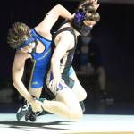 Sequims Owen Tjemsland, right, grapples with Bainbridges Owen Williams in a junior varsity match on June 5. Tjemsland won the back-and-forth affair, 13-9. Sequim Gazette photo by Michael Dashiell