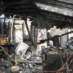 At one point, 25 firefighters were on scene from multiple agencies working to battle a fire on Spruce Street and prevent it from spreading to nearby residences. Sequim Gazette photo by Matthew Nash