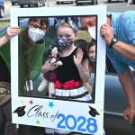 Fifth grade teacher Ashley Kramer and Aaron Reno celebrate Greywolf Elementary fifth-grader Maddy Parker on the schools final in-person day on June 16. Sequim Gazette photo by Michael Dashiell