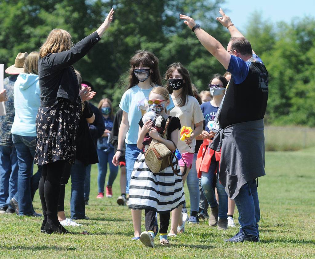Greywolf Elementary School staffers offer a sweet end-of-the-School year at the school playfield on June 16. Students pictured include Madeline Parker (foreground) and, from left, Madeline Parker and Katie Simpler, Megan Simpler and Reagan Whitmarsh.