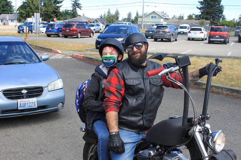 Greywolf Elementary fifth-grader Rhys Anglin, pictured here with Tommy Buck, enjoys a send-off at the schools final in-person day of instruction on June 16. Photo by Darcy Lamb