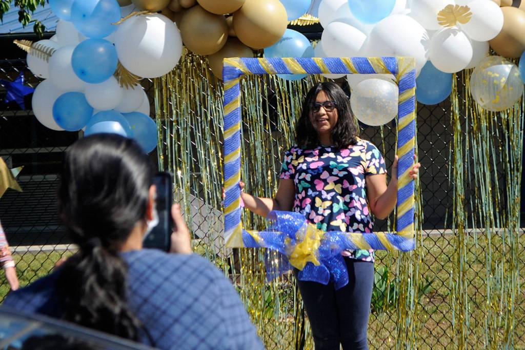 Fifth grader Prachi Faldu smiles for a photo for her mom during a drive-through graduation at Helen Haller Elementary on June 17. Sequim Gazette photo by Matthew Nash