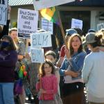 Mariia Bush stands with her two daughters Madison, 9, and Avery, 6, during the Juneteenth Protest Against Racism and Hate on June 19 in downtown Sequim. Bush said shes participated in rallies before thanks to her neighbors Neil and Suzi Morris informing her of them. She takes her children to events like these to educate them about history and how best to treat other people, she said. Sequim Gazette photo by Matthew Nash