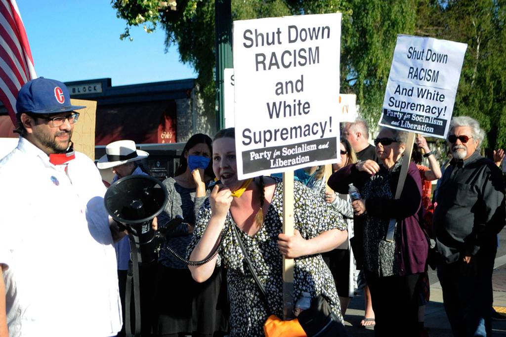 Stacey Sevier of Sequim speaks during a Saturday protest in downtown Sequim about her experiences working at Blondies Plate and she encouraged its owner Josh Armstrong to apologize to those impacted in person over an alleged racist act outside his restaurant on June 12. Sequim Gazette photo by Matthew Nash