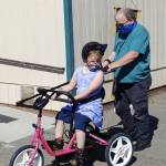 A Sequim students enjoys a ride on a newly-donated adaptive bicycle, donated by Rotary Club of Sequim. Submitted photo