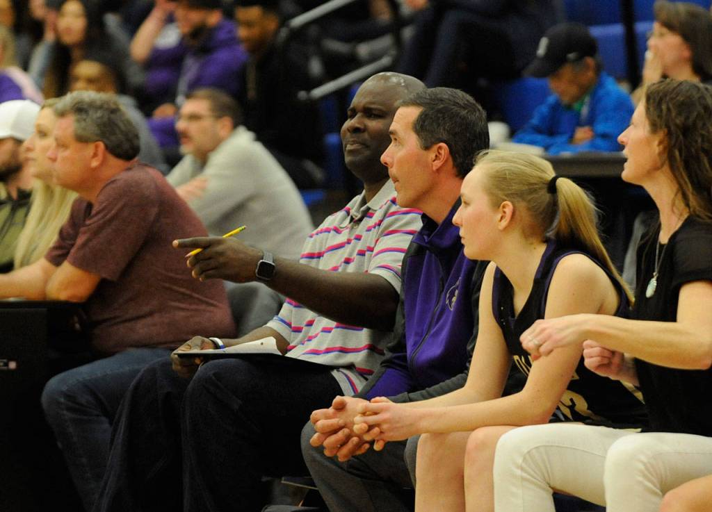Sequim High girls basketball assistants Joclin Julmist and Sven Wiker confer during a 2020 Olympic League game. Sequim Gazette file photo by Michael Dashiell