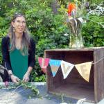 Christine Loewe, executive director for the Port Angeles Fine Arts Center, prepares a table display for the 2021 Summertide event at the center in Port Angeles. Photo by Keith Thorpe/Olympic Peninsula News Group