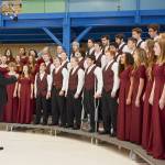 The Sequim High School Select Choir, directed by John Lorentzen, sings The Star-Spangled Banner in the hanger at U.S. Coast Guard Air Station/Sector Field Office on Veterans Day in 2019. Sequim Gazette photo by Michael Dashiell