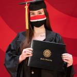 At right: Sequim High grad Hilary Holtrop accepts her bachelor of arts degree at Pacific University on May 15. Photo courtesy of Pacific University