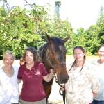 Tasha Therapeutic Equestrian Center advocates are seeking volunteers and donors. Pictured, from left, are board member Susie Hancock, program coordinator Julia Montagnet, treasurer Rachel Tax and president Kaitlin Nicholas. Submitted photo