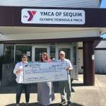 Sound Community Bank donates $7,500 to the Olympic Peninsula YMCAs Annual Impact Campaign. Pictured, from left, are: Gail Sumpter, YMCA of Sequim Branch Executive; Shelli Robb-Kahler, Sound Community Bank branch manager, and Gary Huff, YMCA of Sequim Board Member and Campaign Chair. Photo courtesy of Olympic Peninsula YMCA