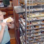 Emmaly Wood of Joyce, 10, arranges slices of blackberry pie for sale to the public during the 2018 Joyce Daze Wild Blackberry Festival in Joyce. The event is back on after a one-year hiatus in 2020  because of the COVID pandemic. File photo by Keith Thorpe/Olympic Peninsula News Group