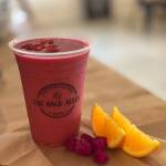 The pink smoothie is called Dragon Berry smoothie with dragon fruit, banana, raspberries, Goji, berries, orange juice and coconut milk. Submitted photo