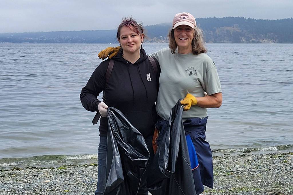 Jenny Blenk, left, said she visits Sequim often, and visits her mom Susan, seen here doing a cleanup at Gardiner Beach with the Olympic Peninsula Paddlers kayaking group. Blenk said her parents moved to Sequim in the 1980s, and she was born and raised here before moving for college. Photo courtesy of Jenny Blenk