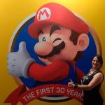 Jenny Blenk, formerly of Sequim, stands by a banner for the Super Mario Bros. Encyclopedia at the 2018 San Diego ComicCon. Blenk said it was one of the most grueling books I ever worked on. Photos courtesy of Jenny Blenk