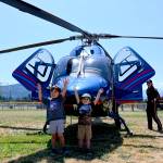 Bryson Yanik, 5, at left, and his 3-year-old brother Wylie enjoy checking out the Life Flight Network helicopter at Sequim Little Leagues 2021 season-ending ceremonies on July 10. Sequim Gazette photos by Michael Dashiell
