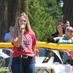 Michaela Green sings the National Anthem at Saturdays Little League season-closing ceremonies.