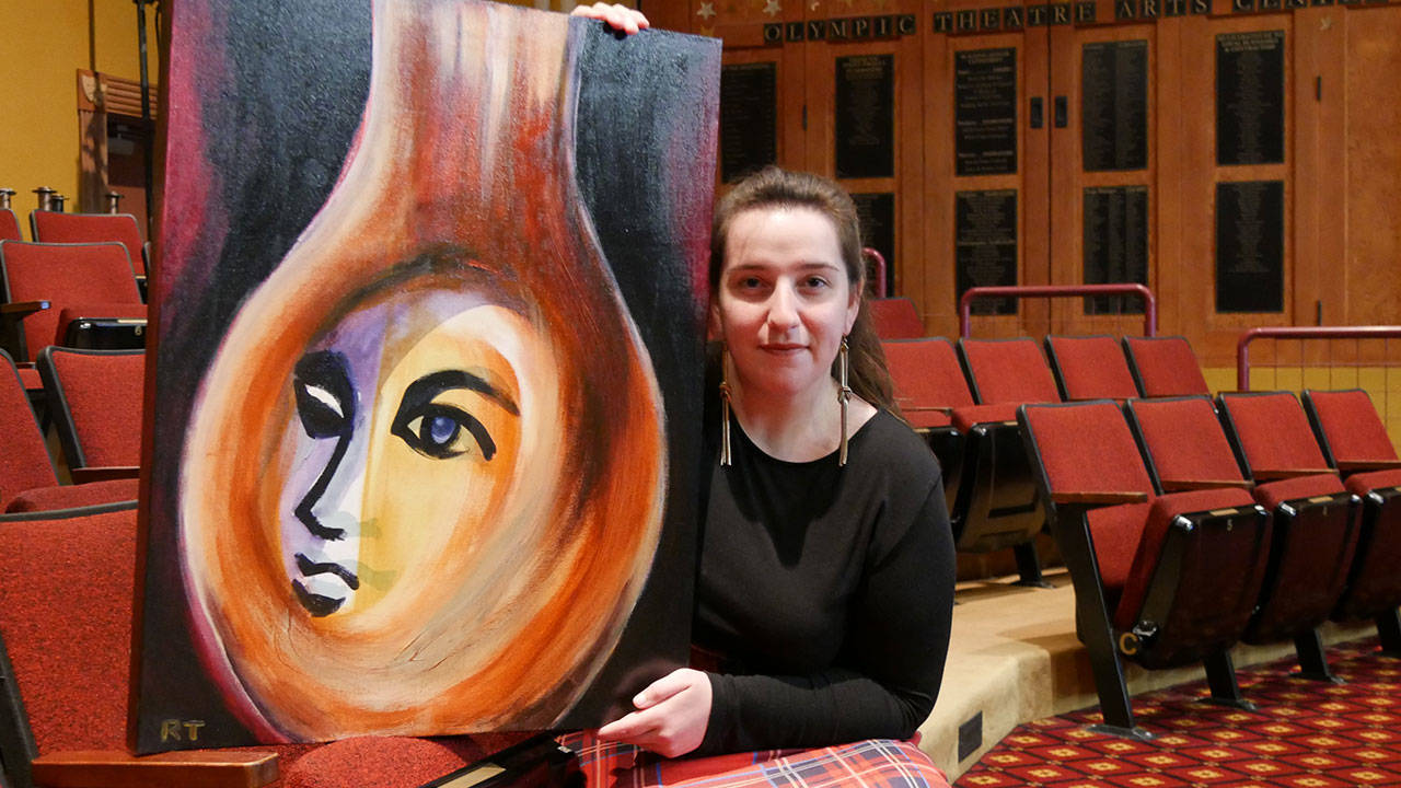 Ginny Holladay holds artwork for Olympic Theatre Arts production of Angel Street, set to stage Feb. 10-27, 2022. The artwork was created and donated by Ryoko Toyama. Submitted photo