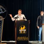 Peninsula College mens soccer coach Andrew Chapman, left, and Peninsula womens coach Kanyon Anderson help host the unveiling of a Pirate-themed sculpture following the NWAACCs first dual back-to-back championship teams in November 2013. Sequim Gazette file photo by Michael Dashiell