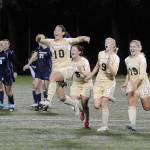 With tournament MVP Briana Afoa (10) leading the way, Peninsula Colleges womens soccer squad celebrates their first NWAACC championship in November 2012. The team, along with PCs womens 2013 team and 2012 and 2013 mens soccer teams, will be inducted into the schools Hall of Fame in September. Sequim Gazette file photo by Michael Dashiell