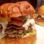 The Bacon Blues features three patties, crumbled blue cheese, applewood smoked bacon, roasted garlic aioli, house blue cheese dressing, red onion, lettuce and a tomato on an artisan bun. Photo courtesy of Shadowline Burgers and Brews
The Bacon Blues features three patties, crumbled blue cheese, applewood smoked bacon, roasted garlic Aioli, house blue cheese dressing, red onion, lettuce and a tomato on an artisan bun. Photo courtesy of Shadowline Burgers and Brews