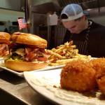 Cook Tyler Tegoseak and Head Chef Mark Diaz prepare multiple meals, including a few elevated burgers at Shadowline Burgers and Brews. Photo courtesy of Shadowline Burgers and Brews