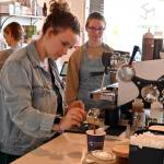 Emily Gogos makes a drink while fellow staffer Tyanna Koehn looks on at Essence Coffee Roasterss one-year anniversary celebration on July 22. Sequim Gazette photo by Michael Dashiell