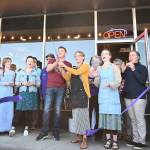 Rod and Megan Dirks cut a ceremonial ribbon at Essence Coffee Roasterss one year anniversary celebration on July 22, hosted by the Sequim-Dungeness Chamber of Commerce. Sequim Gazette photo by Michael Dashiell