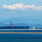 Contributor Kip Tuplin caught this image of the USS Teddy Roosevelt  a Nimitz-class, nuclear-powered, aircraft carrier  as it passes the New Dungeness Lighthouse on July 22. The U.S. Navy ship, along with 2,500 sailors and their families, are calling the Puget Sound their new home for the next year and a half at Naval Base Kitsap in Bremerton.