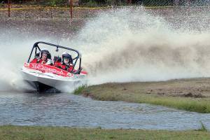 Keith Thorpe/Peninsula Daily News
The Ynot Racing sprint boat racing team of navigator Jamie Johnson, left, and driver Dave Brown makes it way around the course in 2019 at Extreme Sports Park in Port Angeles.