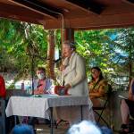 Poet Tess Gallagher shares a portion of her essay, Two Northwests with the audience at Railroad Bridge Parks amphitheater on July 25, flanked by some of the poets published in the new book, Keep a Green Bough: Voices from the Heart of Cascadia. Keep a Green Bough was published this summer by Empty Bowl press and its Madrona Project journal of prose and poetry. Its pages travel, in words and visual art, around the Pacific Northwest to the traditional lands of the Coast Salish and other native tribes. Sequim Gazette photo by Emily Matthiessen