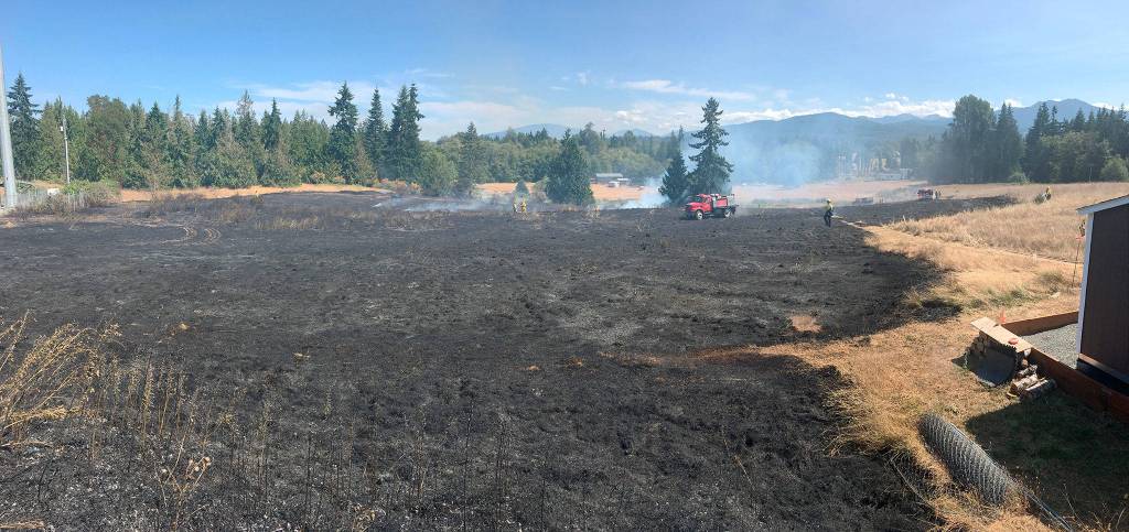 Fire officials estimate more than five acres was burned in a brush fire on July 27. Sequim Gazette photo by Matthew Nash