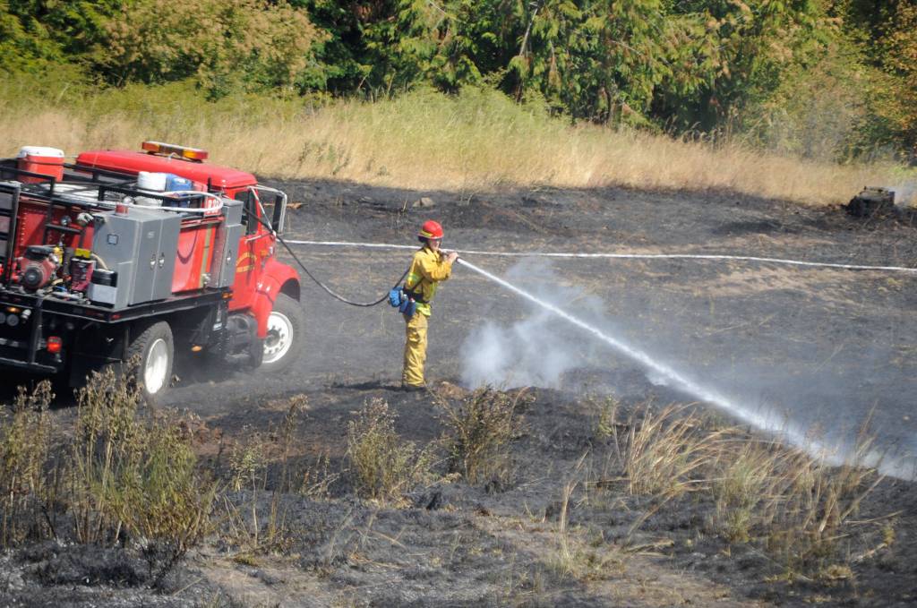 Fire officials estimate more than five acres was burned in a brush fire on July 27. Sequim Gazette photo by Matthew Nash