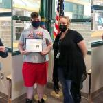 From left, Sequim Middle School students Clare Turella (with principal Mark Harris), James Dorrell (with assistant principal Candice Ward) and Skylar Krzyworz (with Harris) accept their Maxene Brandt Patriotic Youth Awards. Submitted photo