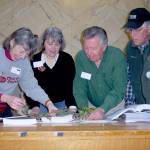 Veteran Master Gardeners Jeanette Stehr-Green, Cindy Erickson, Nye Nelson (retired) and John Norgord investigate a problem with a hemlock tree at a plant clinic. Submitted photo