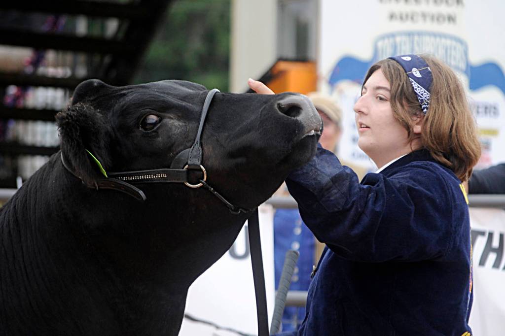 Levi Adolphe, 6, holds his turkey Jake in place as they await their turn.