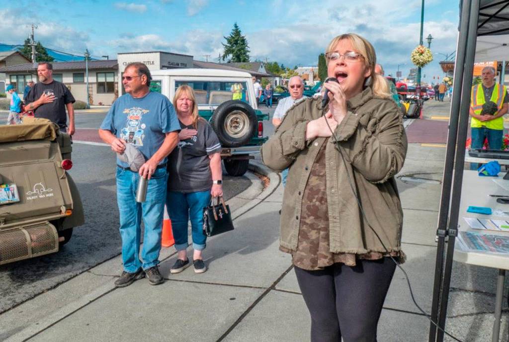 Amanda Bacon sings Star Spangled Banner to kick off Saturdays Sequim Prairie Nights event. Photo by Bob Lampert