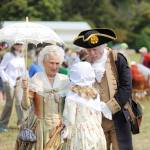 Martha Washington (Jane Ritchey) and George Washington (Vern Frykholm Jr.) meet with a young visitor at the Northwest Colonial Festival in 2019. The pair return this year Aug. 12-15 for daily visits with guests. Sequim Gazette photo by Michael Dashiell