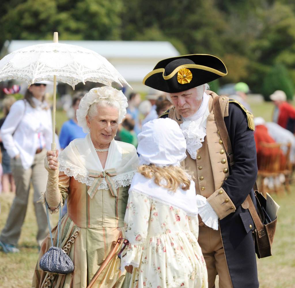 Martha Washington (Jane Ritchey) and George Washington (Vern Frykholm Jr.) meet with a young visitor at the Northwest Colonial Festival in 2019. The pair return this year Aug. 12-15 for daily visits with guests. Sequim Gazette photo by Michael Dashiell