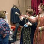 Patty McArthur is fanned by Lady Margaret Trople and Lady Merrin Parker. This is Troples first time in a costumed role for the theater; she started out as an assistant barkeeper. Packer says she is participating in it because likes doing theater and, I love getting involved in my community. Sequim Gazette photo by Emily Matthiessen