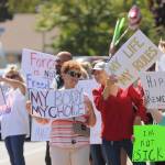 More than 100 protestors fill the corners of Washington Street and Sequim Avenue on Aug. 18. Sequim Gazette photo by Michael Dashiell