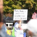 More than 100 protestors fill the corners of Washington Street and Sequim Avenue on Aug. 18. Sequim Gazette photo by Michael Dashiell