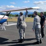 Cadets Joseph Maggard of Port Angeles and Reilly Sue of Sequim test aircraft aileron as Captain John Weidman of Bremerton looks on. Submitted photo