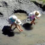 Siblings Sequoia Mitchell, 9, and Coco Mitchell, 6, both of Sequim, attempt to catch tadpoles in a side channel of the Dungeness River at Railroad Bridge Park in Sequim on 
Aug. 8. Photo by Keith Thorpe/Olympic Peninsula News Group
