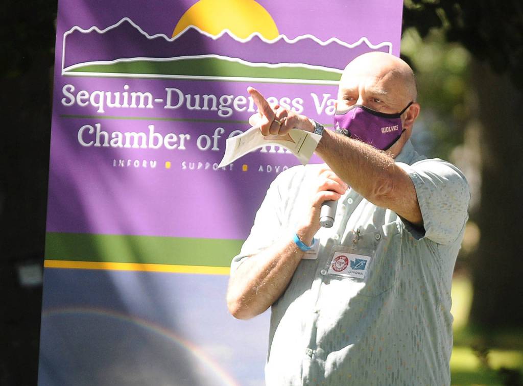 Sequim School Board director Jim Stoffer gives a special shout-out to the Sequim Food Bank for its efforts during the COVID pandemic at the Sequim-Dungeness Valley Chamber of Commerces annual picnic and Citizen of the Year presentation on Aug. 24. The chamber honored essential workers with its 2020 award. Sequim Gazette photo by Michael Dashiell