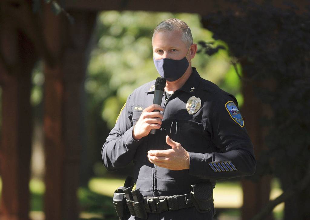Sgt. Mike Hill of the Sequim Police Department thanks fellow essential workers at the Sequim-Dungeness Valley Chamber of Commerces annual picnic and Citizen of the Year presentation on Aug. 24. The chamber honored essential workers with its 2020 award. Sequim Gazette photo by Michael Dashiell