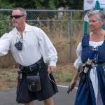Courteney and Katherine Graff toss rats into holes at the Renaissance Faire in the parking lot of Sequim Theatre Arts on Aug. 22. Sequim Gazette photo by Emily Matthiessen