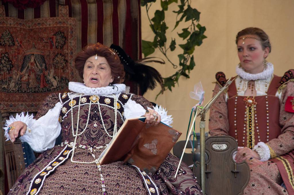 Patricia McArthur, as Queen Elizabeth I, expresses her displeasure to Shakespeare, flanked by maid-in-waiting Merrin Packer, at OTAs Kings, Queens, and Royal Scenes, Renaissance Faire on Aug. 22. Sequim Gazette photo by Emily Matthiessen